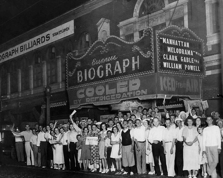 The crowd at Chicago's Biograph Theater on July 22, 1934, shortly after John Dillinger was killed there by law enforcement officers. The extra edition newspapers with the headline "Dillinger Dead" are being displayed and waved by some in the crowd. Manhattan Melodrama as shown on the marquee, was playing at the time.
